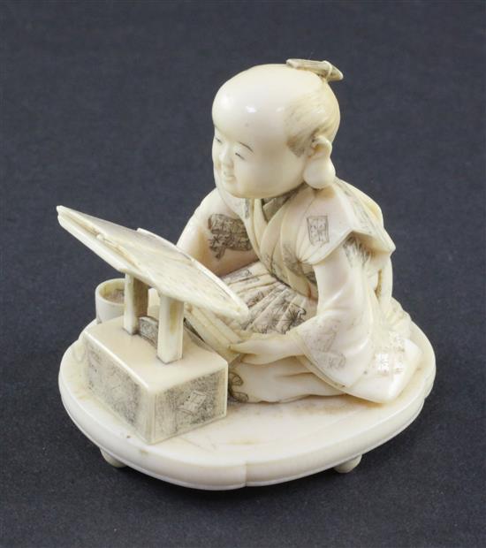 A Japanese Meiji ivory okimono of a scribe, 2.5in.